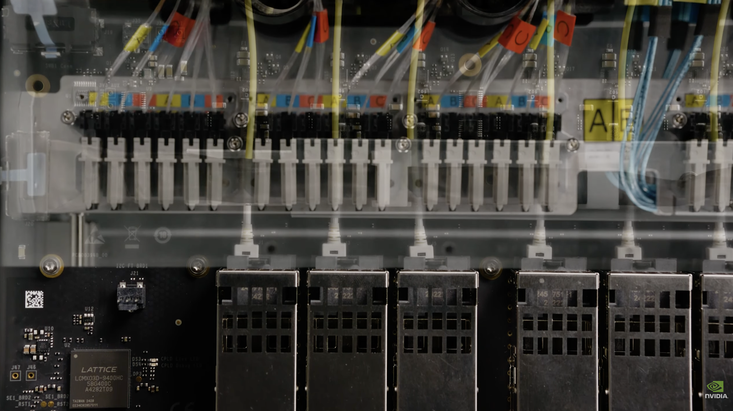 MMC connectors above, front-panel OSFP cage row directly below — the physical hand-off point inside the chassis
